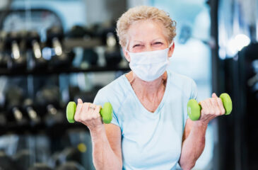 masked woman working out